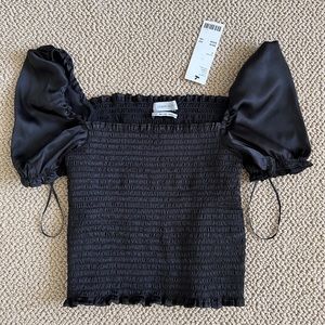 Urban Outfitters black short sleeved blouse. Size Small. Brand new.